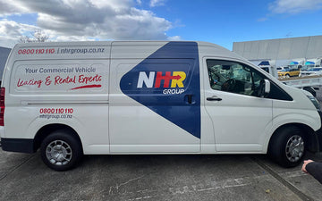 White NHR Group commercial van with blue, red, and yellow branding, showcasing "Leasing & Rental Experts" and contact details